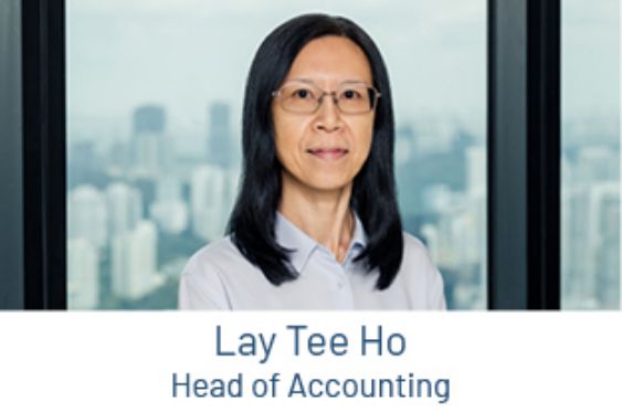 Portrait of Lay Tee Ho, Head of Accounting, in front of a window