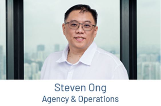Portrait of Steven Ong, Agency and Operations, in front of a window