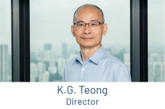 Portrait of K.G. Teong, Director, in front of a window